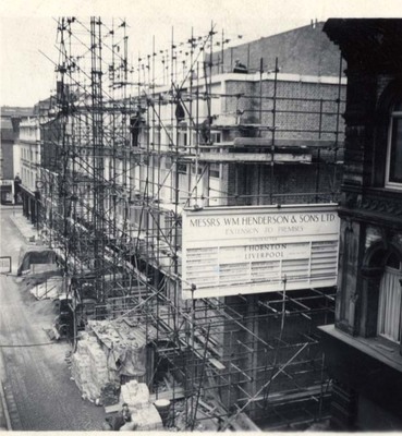 Rebuilding William Henderson & Sons after fire, 1962.